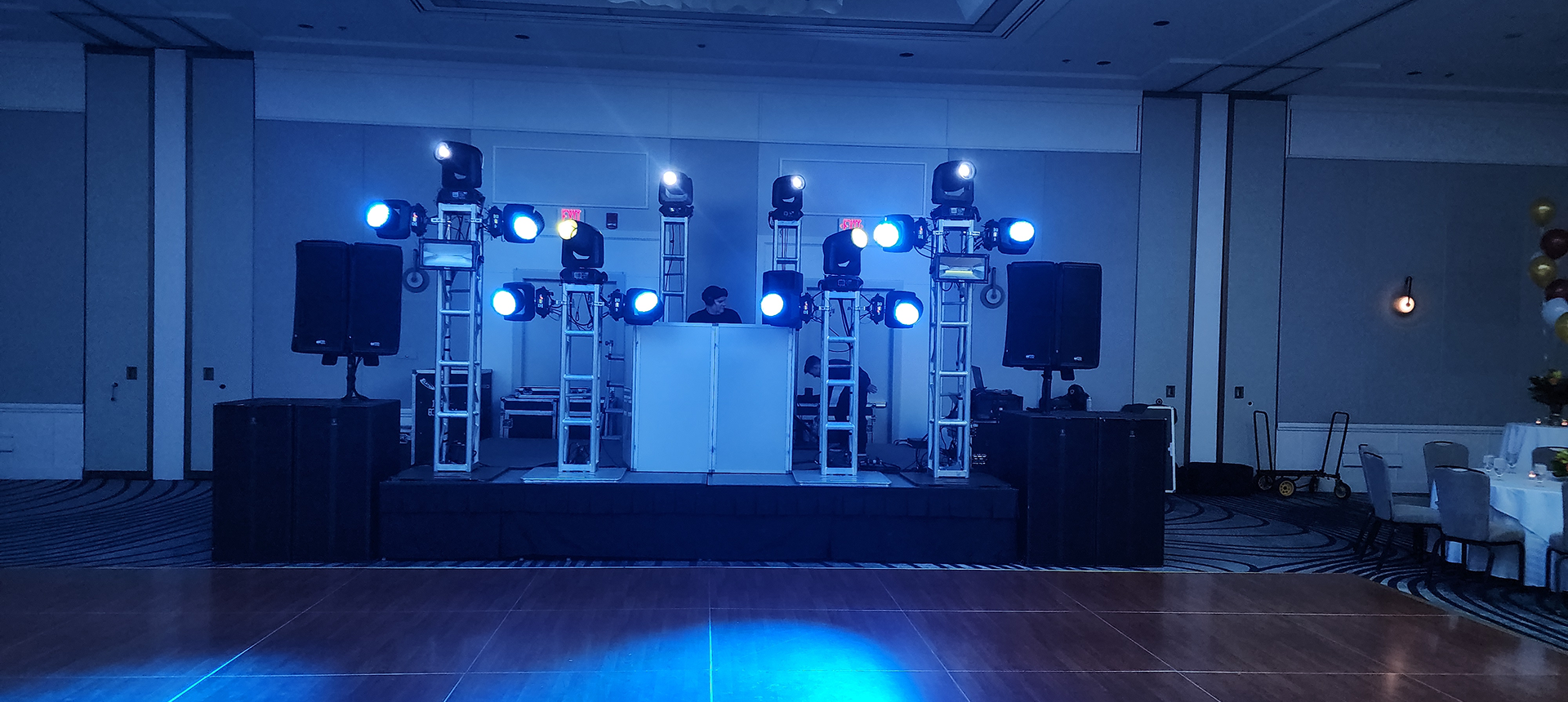 DJ stage setup with blue lighting