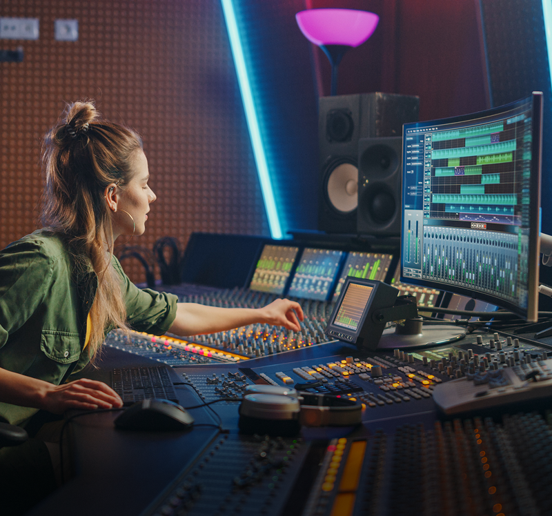 Sound engineer at mixing console