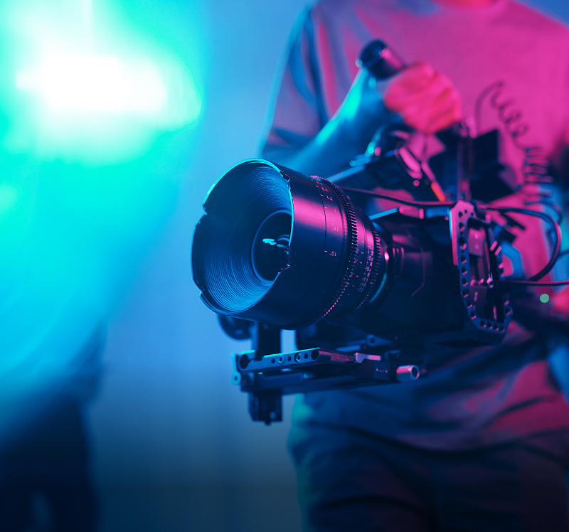 Cinematographer holding a professional film camera